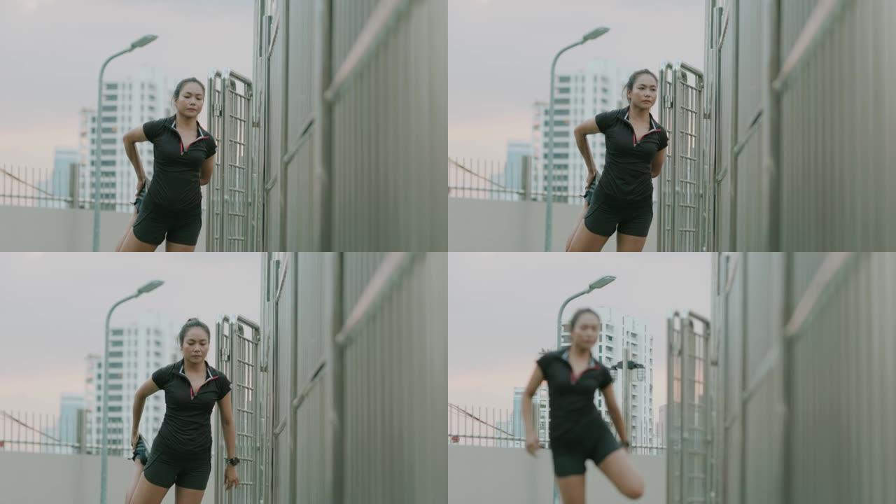 亚洲女性伸展肌肉开始体育锻炼或在城市中慢跑-股票视频