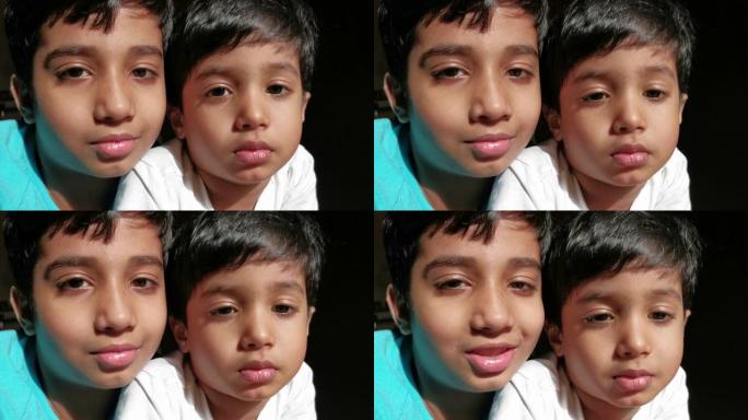 两个快乐的笑脸孩子看着镜头