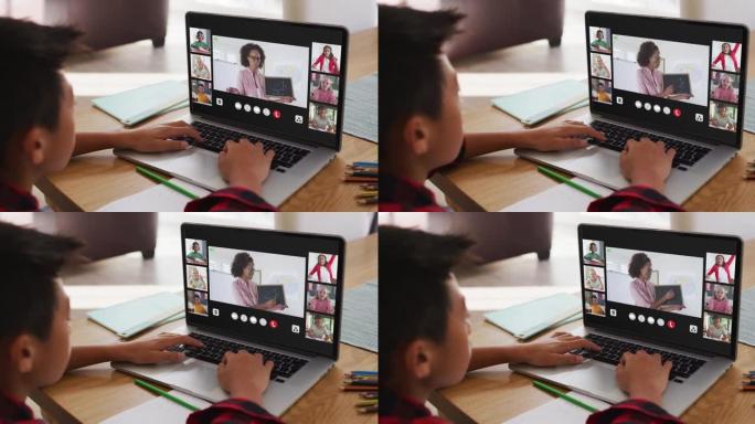 亚洲男孩在家与老师和同学在笔记本电脑上进行视频会议