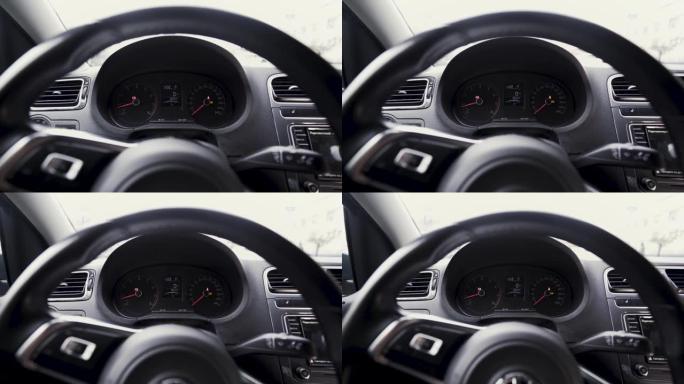 查看车内与仪表盘后面的方向盘。行动。接近发动机速度刻度，运输概念。
