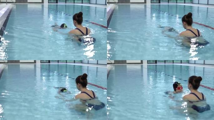 游泳课水上教练教练教小孩在游泳池潜水