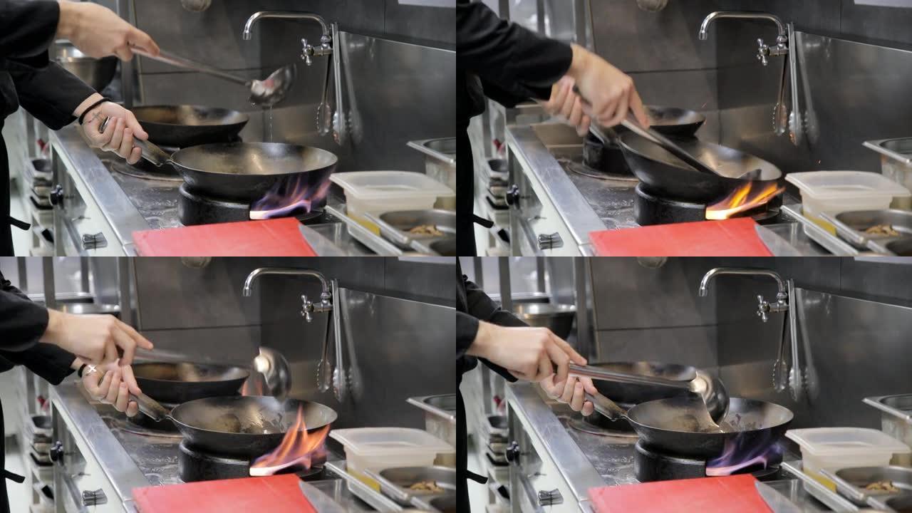 厨师的手将锅中的钢包油倒在煤气炉火焰上，以在烹饪前将其加热