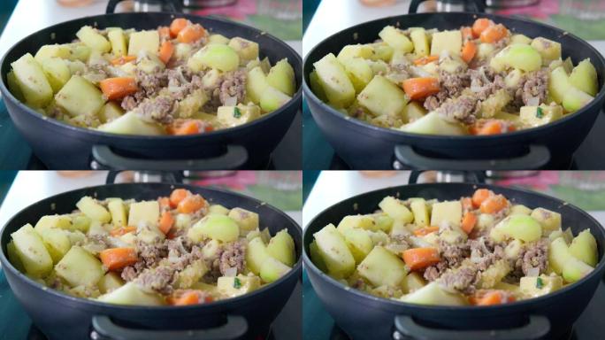 用土豆切碎的西葫芦胡萝卜炖煮。自制食品概念