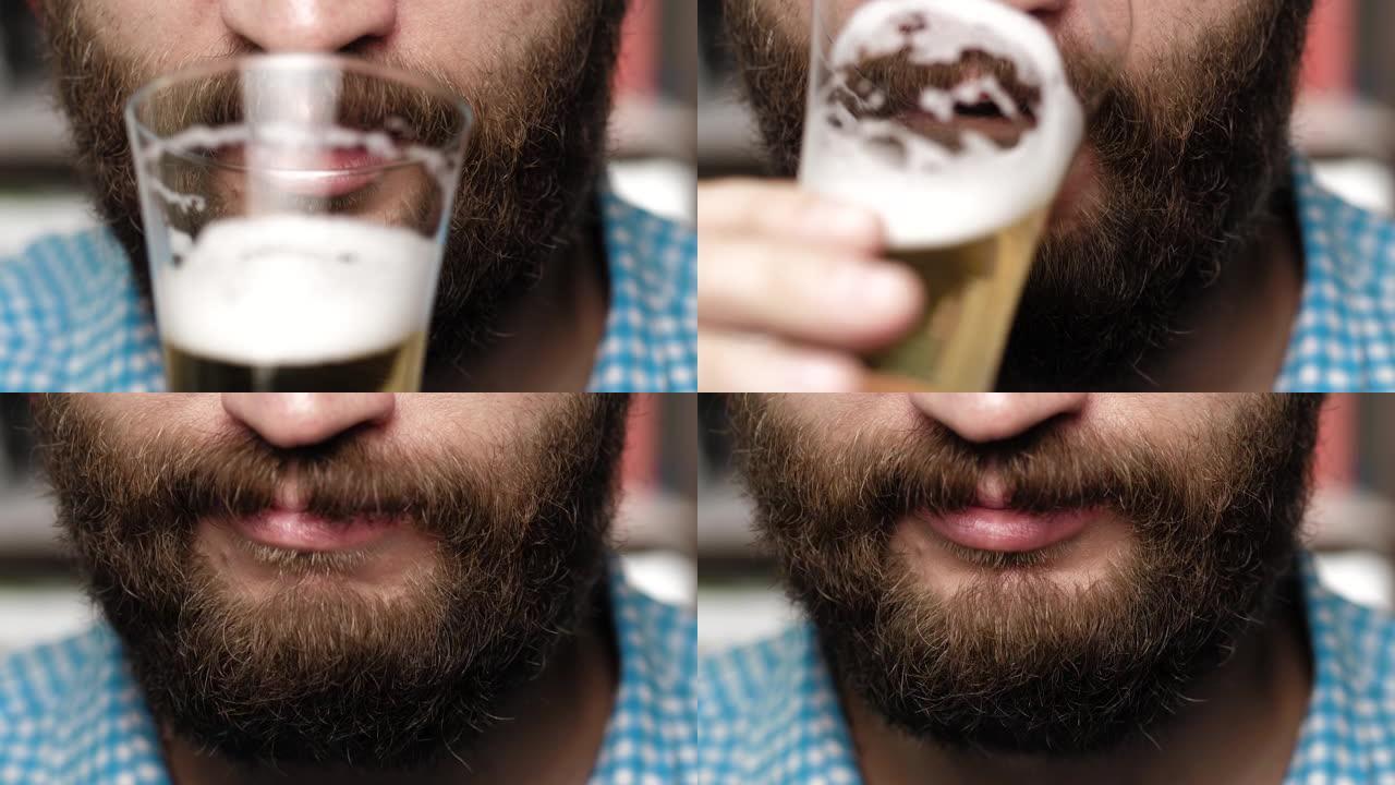 大胡子的人正在喝啤酒。男性的手拿着装满泡沫的玻璃杯到嘴里，喝啤酒。特写