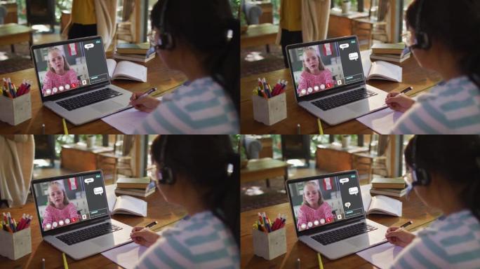 女学生在家使用笔记本电脑上在线课，女孩在屏幕上聊天和网络聊天