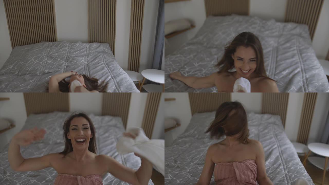 快乐的年轻女子在早上洗完澡后拍摄自拍视频