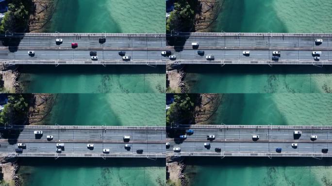 沿海公路和人行天桥横跨清晰的海洋河口，允许人员和车辆穿越。无人驾驶飞机俯视