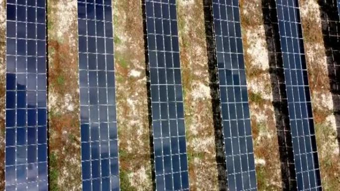 太阳落山时无人机拍摄的太阳能电池板农场鸟瞰图
