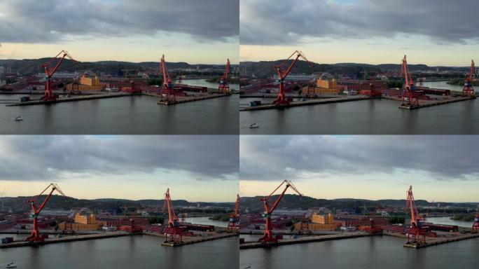哥德堡港是北欧国家最大的港口-瑞典哥德堡的船到岸集装箱起重机。-空中无人机视图。