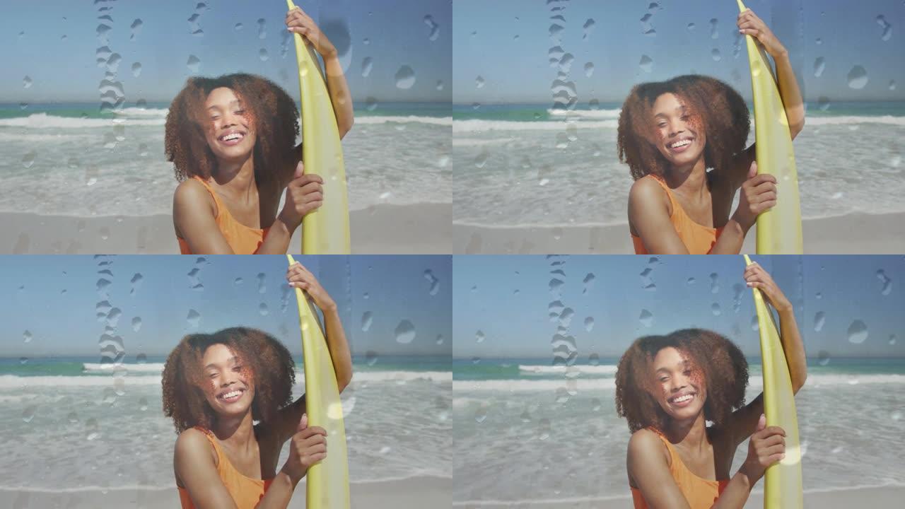 海滩上微笑的非洲裔美国妇女的水滴动画，冲浪板在海上