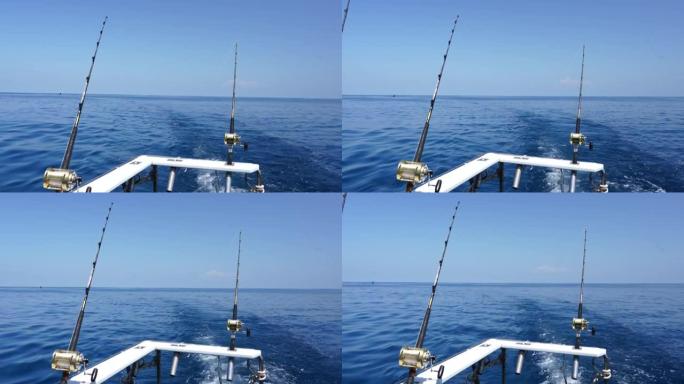 太平洋上的快艇钓金枪鱼。蓝天碧水。钓鱼竿在阳光明媚的日子户外捕鱼。