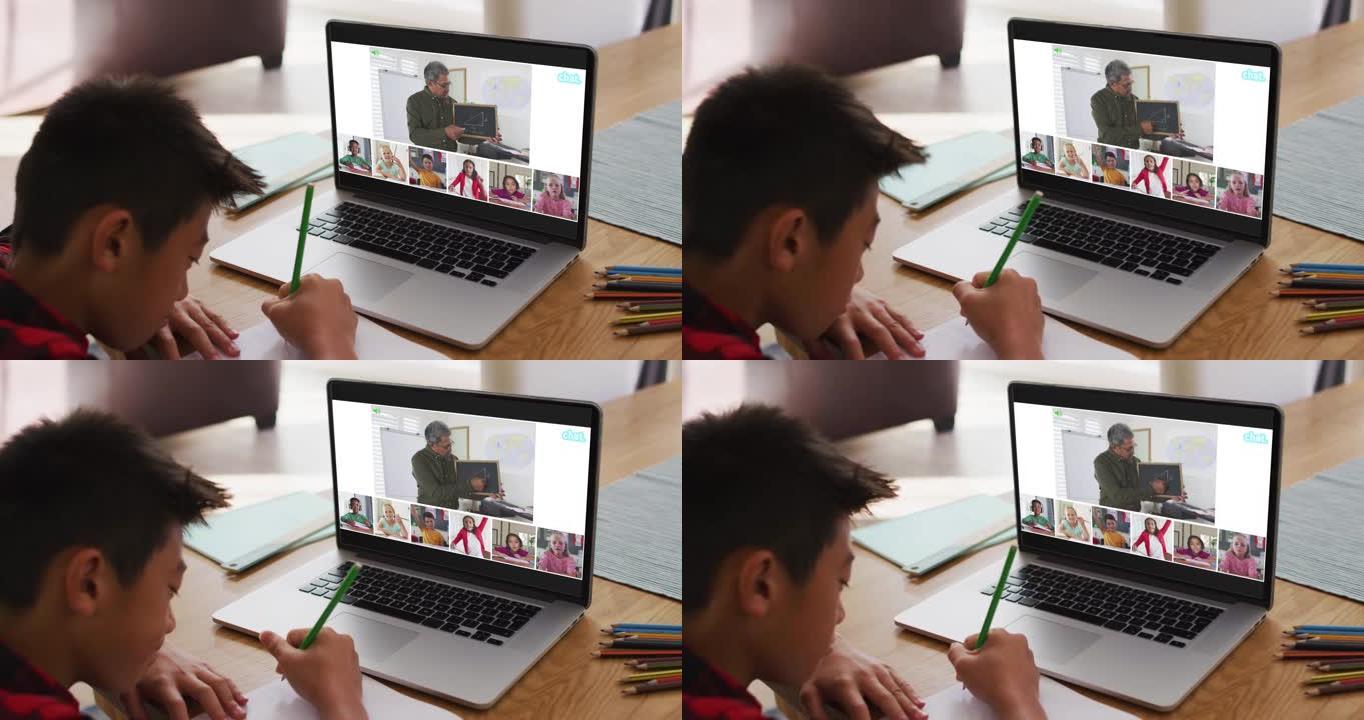 亚洲男孩在家做作业并与老师和同学在笔记本电脑上进行视频会议