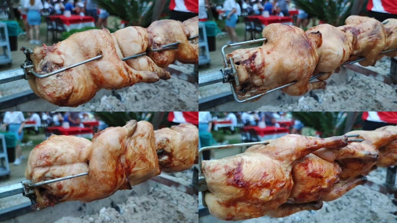美食节，在木炭烤架特写镜头上旋转烤鸡