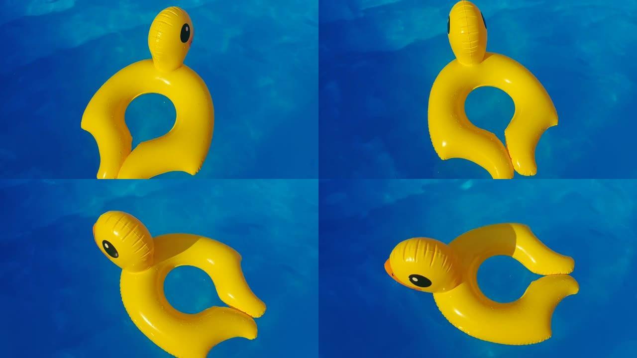 橡胶充气鸭漂浮在游泳池里。