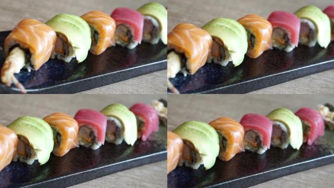 亚洲菜亚洲日本料理餐多种寿司排成一排。自制传统食品旅行烹饪