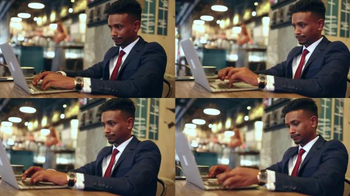 商人在咖啡店的咖啡休息时间使用笔记本电脑