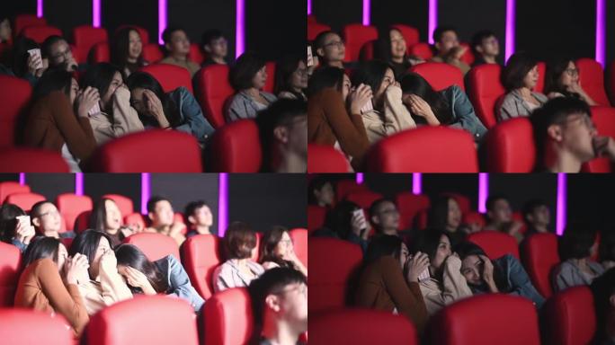 3名亚洲华裔女性在电影院电影院观看恐怖恐怖惊悚电影，并与其他观众面对面