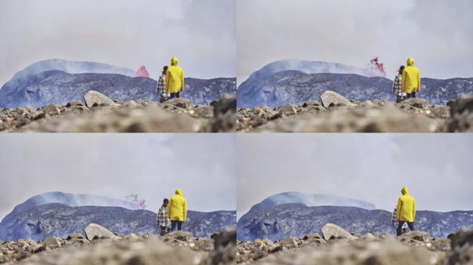 令人敬畏的无人机拍摄了一座喷发的火山，游客欣赏美景