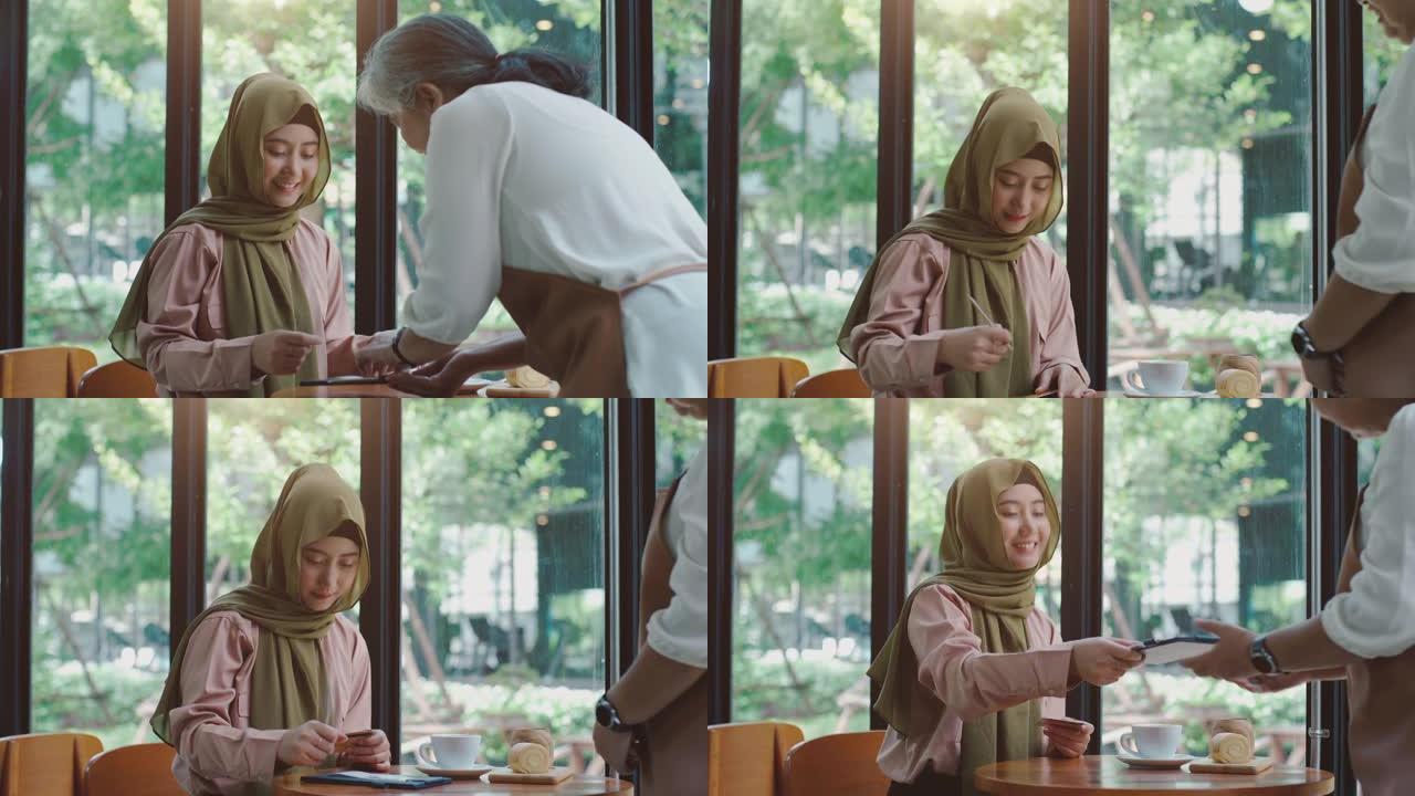 咖啡馆里的年轻亚洲穆斯林妇女