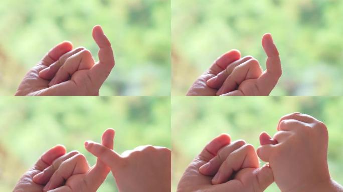 高加索父亲和孩子用手指做粉红色的誓言手势