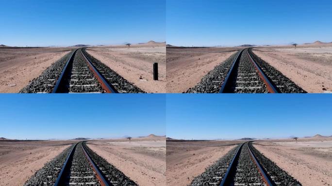 沙漠景观中铁路轨道的非常低的向下视图
