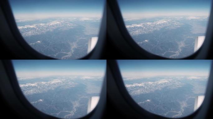 晴空日从飞机窗户看到飞机机翼的云图