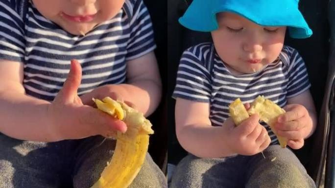 充满沙子的婴儿用香蕉皮弄脏了