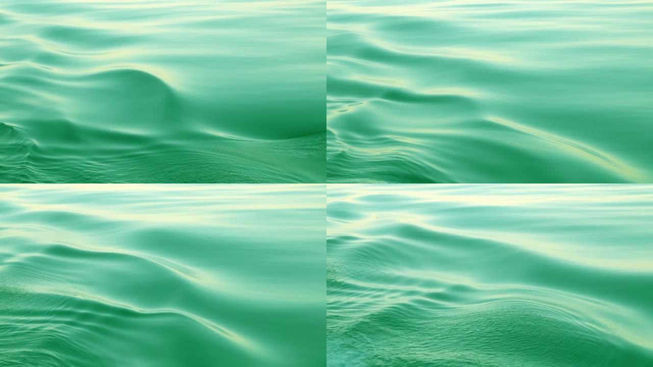 海蓝宝石波浪背景。海平面平稳地移动，形成涟漪。