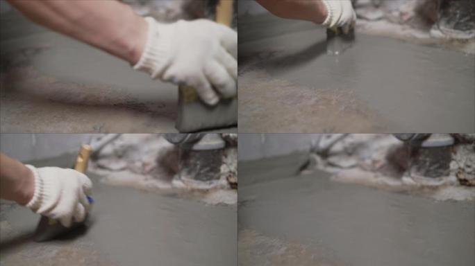用溶液灌注地板的过程。混凝土地板防水。修复防水水泥处理系统前的开裂地板