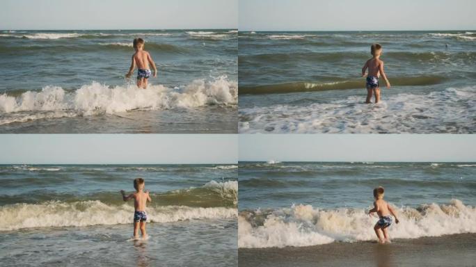 小男孩在海浪上跳入大海