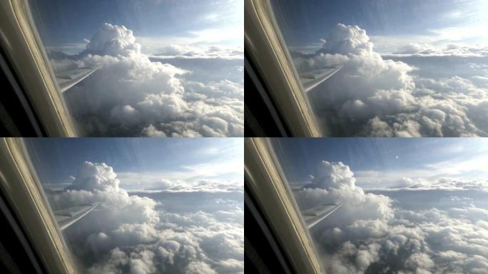 穿过飞机窗户的白云的奇妙景观
