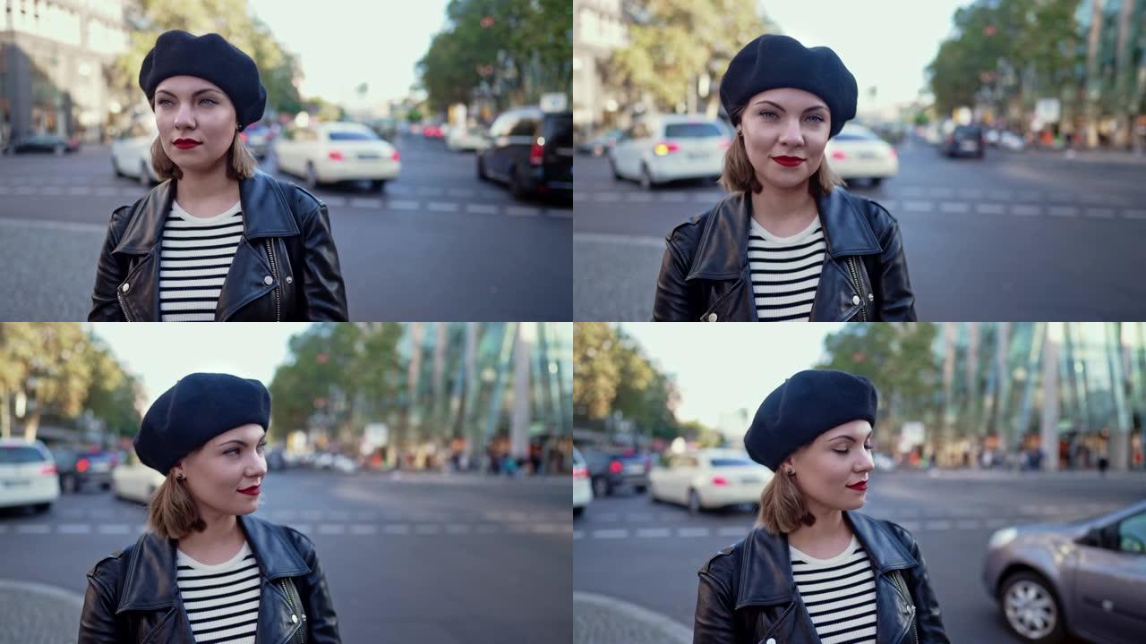 站在繁忙的城市街道上的贝雷帽中时尚年轻女子的肖像。微笑女士，现代都市装，皮夹克和红唇。