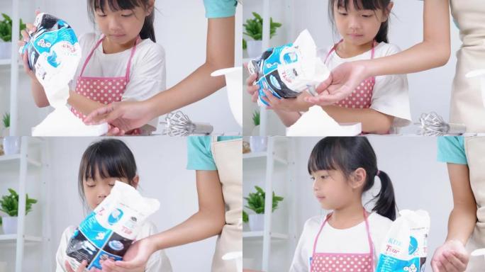 亚洲儿童在家里一起烤饼干前测量面粉准备，生活方式概念。