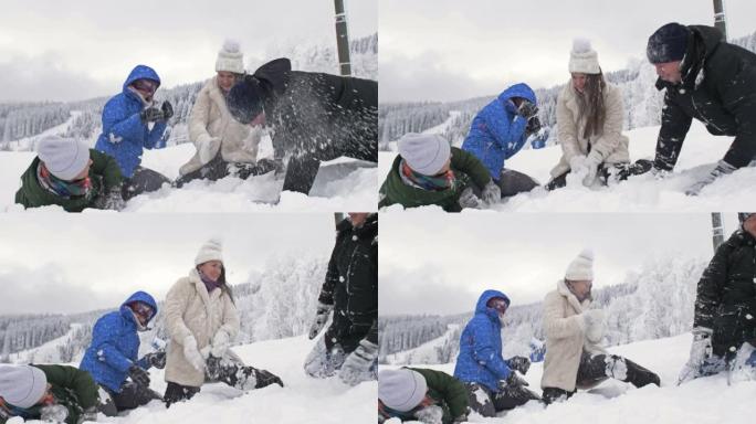 一群朋友兴高采烈地互相撒雪。美好的冬日。在白雪皑皑的森林背景下