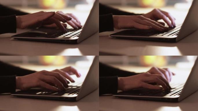 女人手在笔记本电脑键盘上打字网络搜索