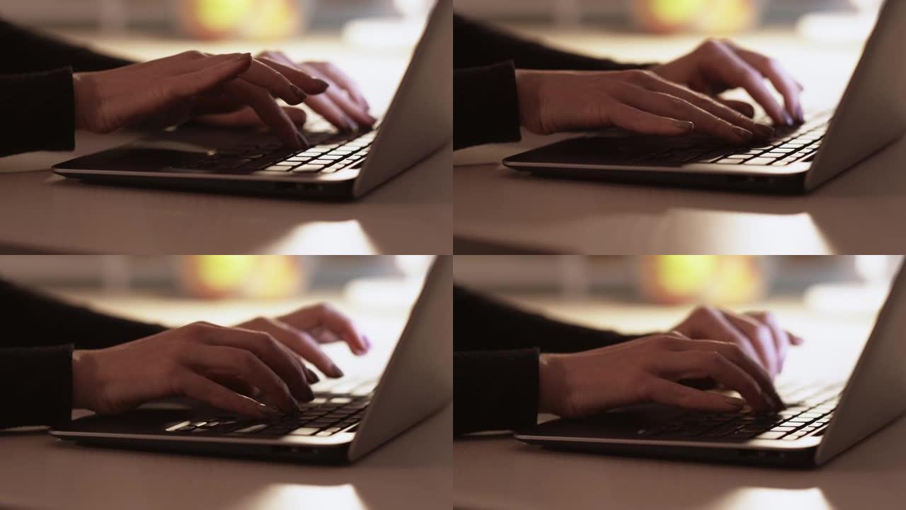 女人手在笔记本电脑键盘上打字网络搜索