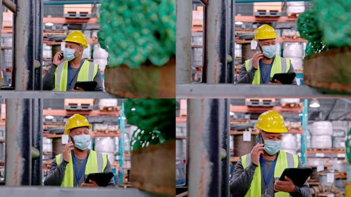一个成熟男人在仓库工作时在手机上聊天并使用数字平板电脑的4k视频片段