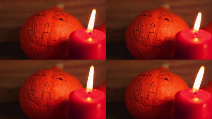 秋季万圣节装饰南瓜可怕的令人毛骨悚然的画脸燃烧蜡烛