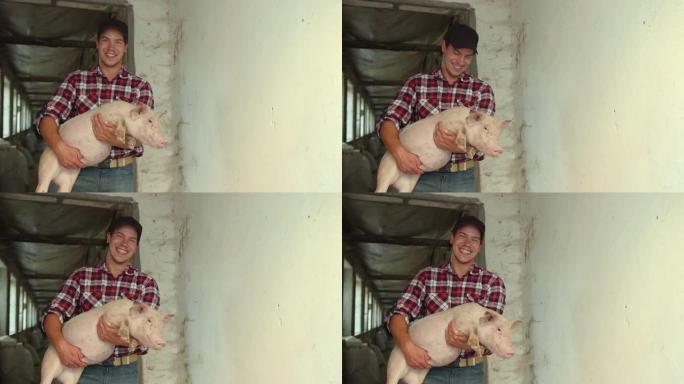农夫抱着一只沉重的小猪