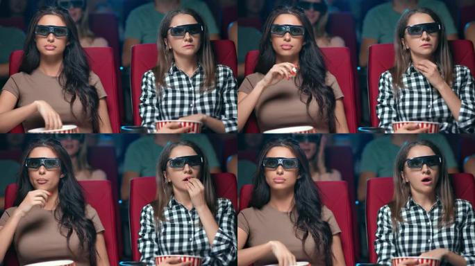 两名女性朋友穿着3d眼镜观看电影首映式，脸表情震惊地坐在一起