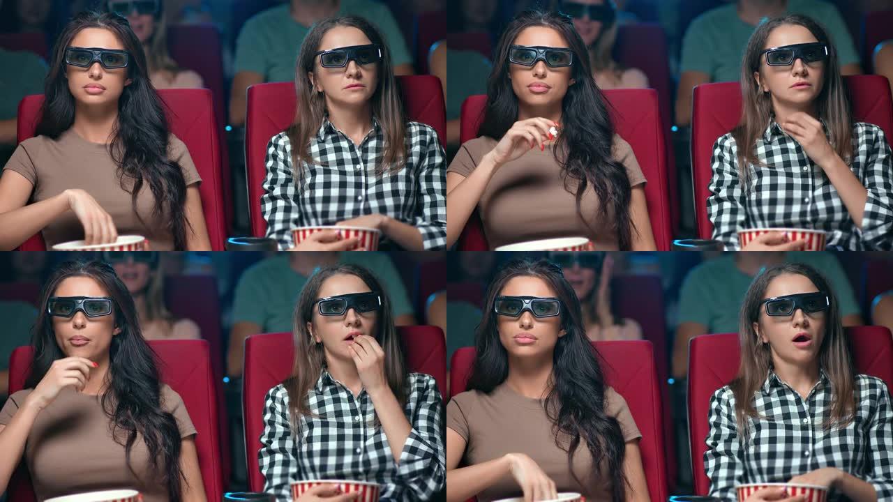 两名女性朋友穿着3d眼镜观看电影首映式，脸表情震惊地坐在一起