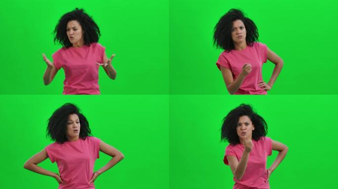 年轻女性非洲裔美国人的肖像发誓，用食指恶毒地摇晃。卷发的黑人妇女在工作室的绿色屏幕上摆姿势。特写。慢