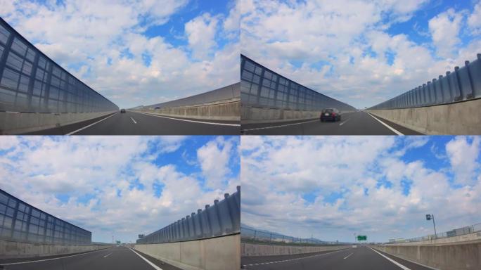 汽车在美丽的蓝天下在高速公路上行驶