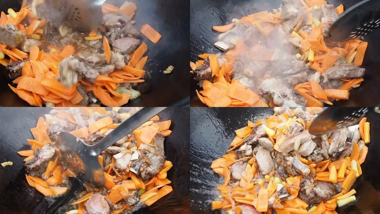 在大锅中搅拌胡萝卜炒肉