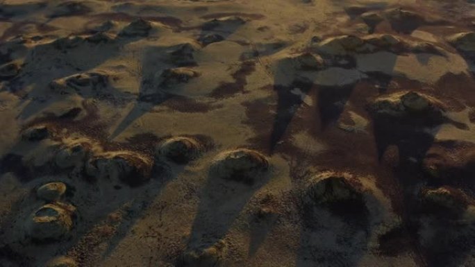 无人驾驶飞机拍摄的岩石土地上的大阴影被投射在太阳上