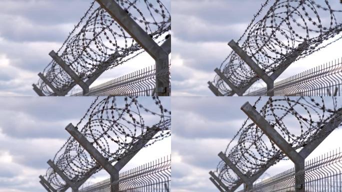 在难民人道主义危机期间，带有铁丝网的金属围栏确保了禁区军事区边界