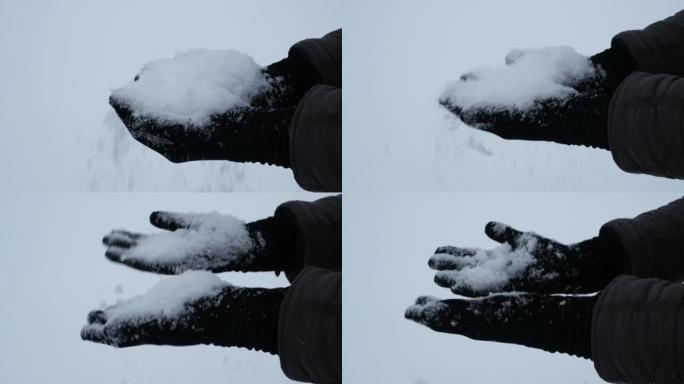 黑手套手中的一把雪