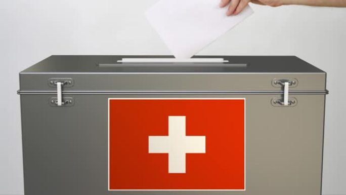投票箱上印有瑞士国旗，并手持纸选票