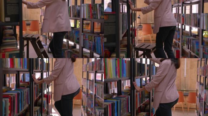 一个年轻的女孩爬上楼梯去买一本书。这个平移的视频显示了旧的木制图书馆楼梯和一个漂亮的图书图书馆。