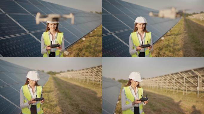 戴着安全帽的女工程师拿着平板电脑在太阳能发电厂操作无人机。光伏太阳能电池板安装。太阳能电池阵列。新技
